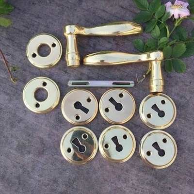 Ручка дверная двухсторонняя с накладкой на замок латунь