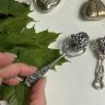 Погремушка Колесо ажурное 10 см серебро